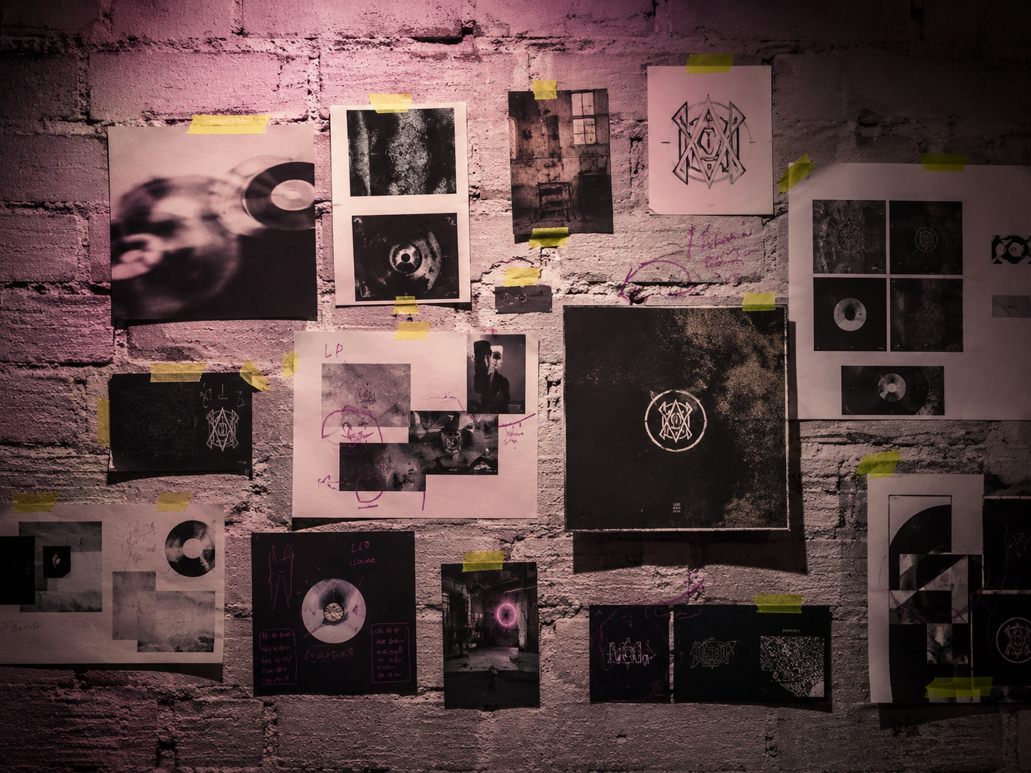 Mood board pinned to brick wall, abstract collages and record sleeves, lime tape strips, mauve marker scribble, theatrical hard light